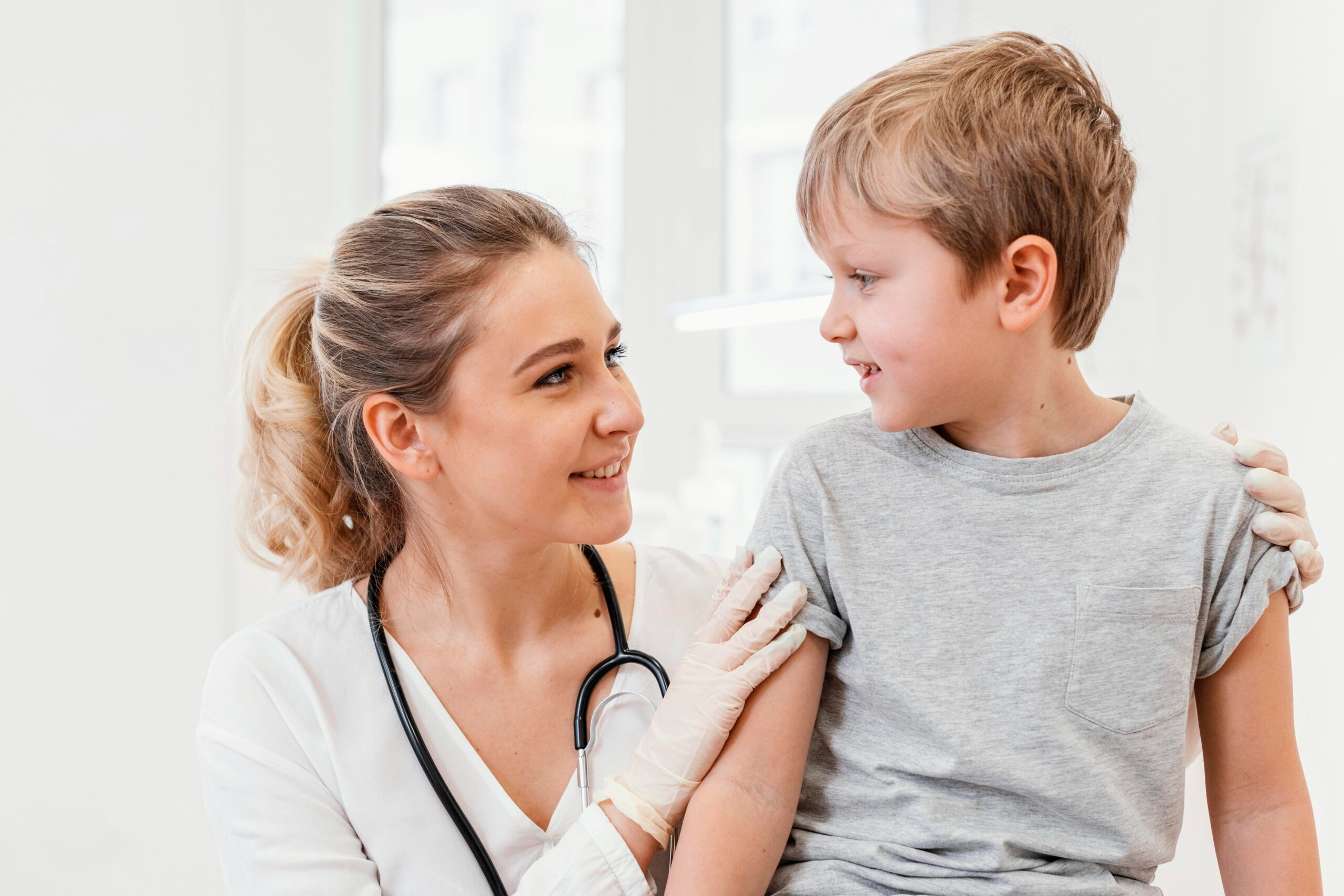 doctor checking a young girl.